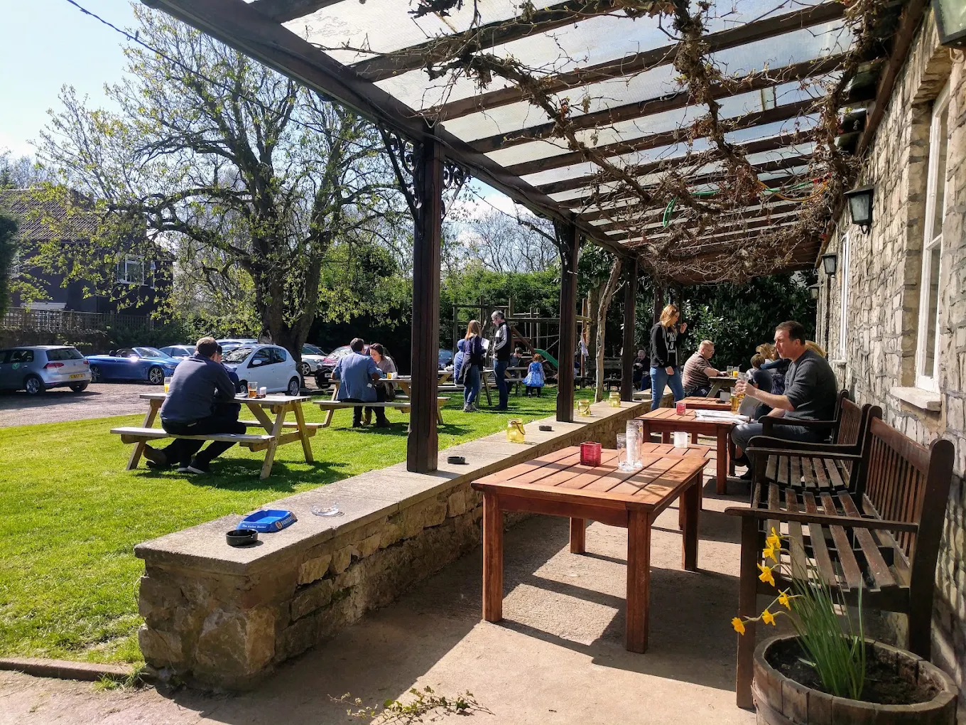 A busy spring afternoon under the vine-covered veranda and out on the lawn